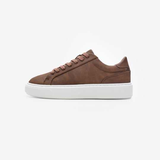 Side view of the Premium Classic Trainer in brown, featuring a clean white PU upper, brown faux suede heel, brown lace-up fastening and cushioned cup sole.