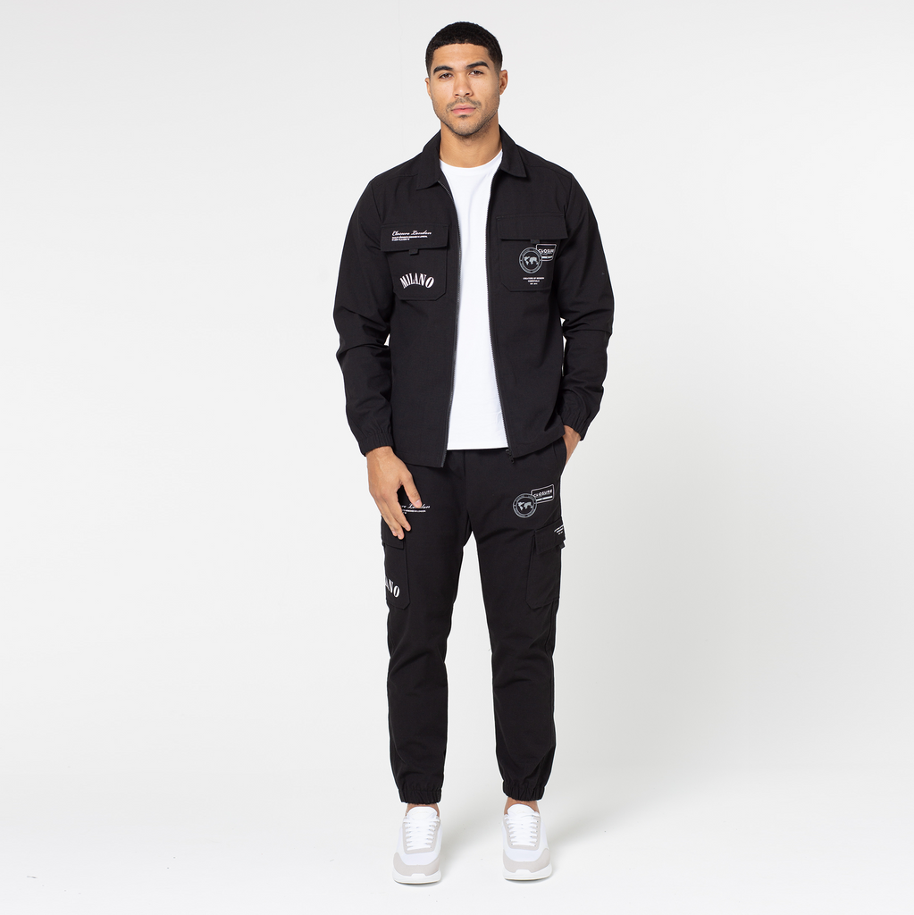 black men's zip up overshirt with matching black trousers and white top