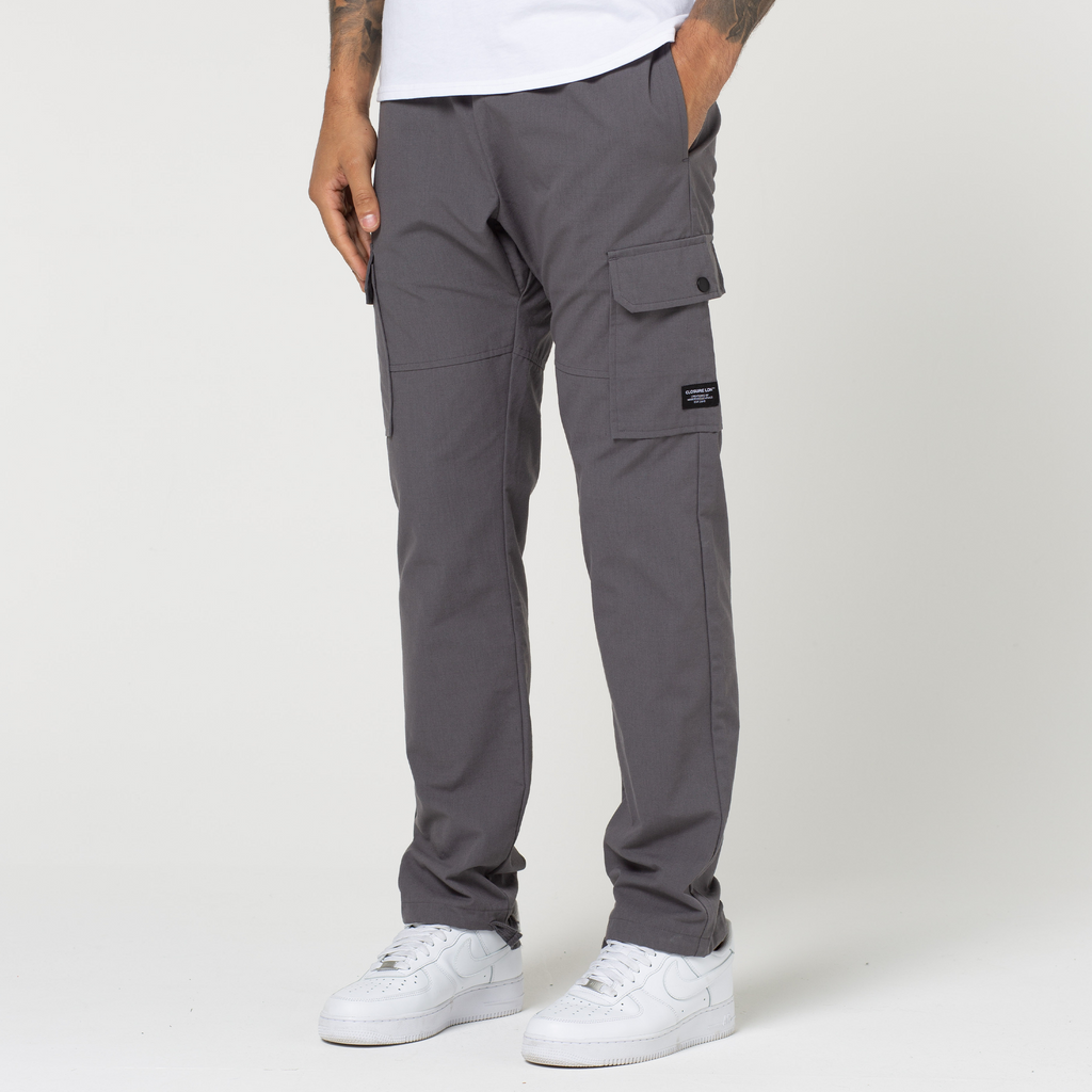 Men's open hem cargo pants in charcoal with white trainers
