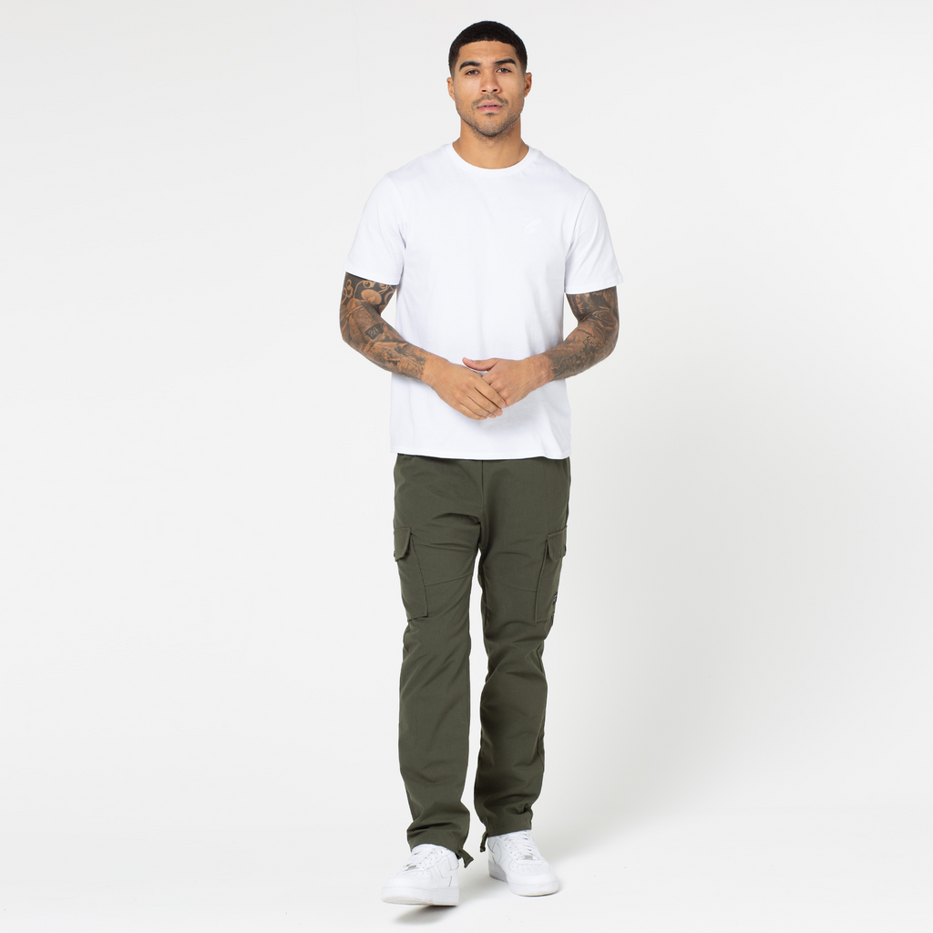 Khaki green open hem utility trousers styled with plain white top and white casual trainers