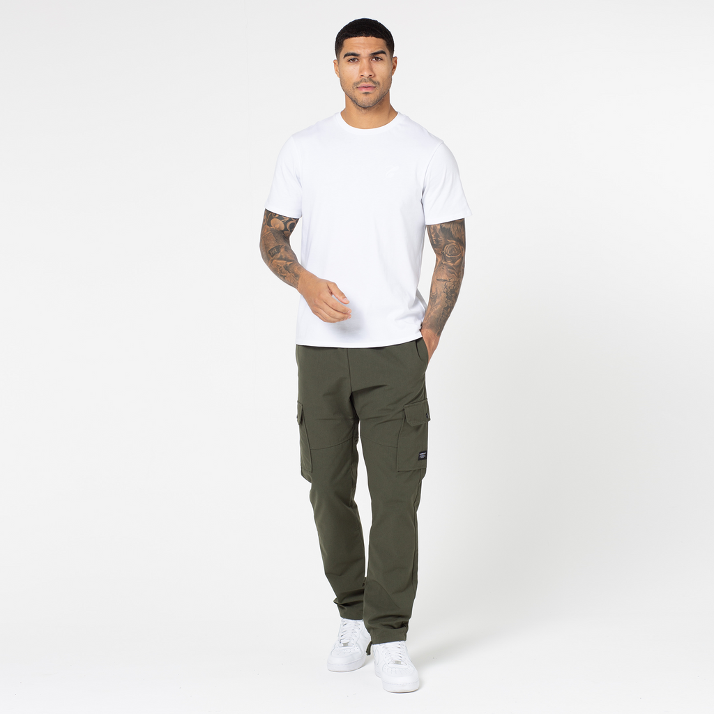 model wearing white tee with men's cargo trousers with an open hem
