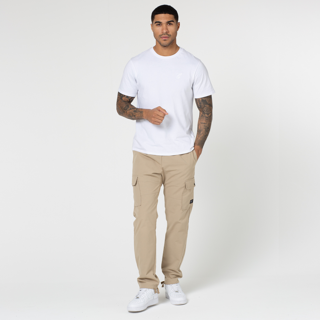 Ripstop open hem utility trousers in sand paired with white short sleeved tee and trainers