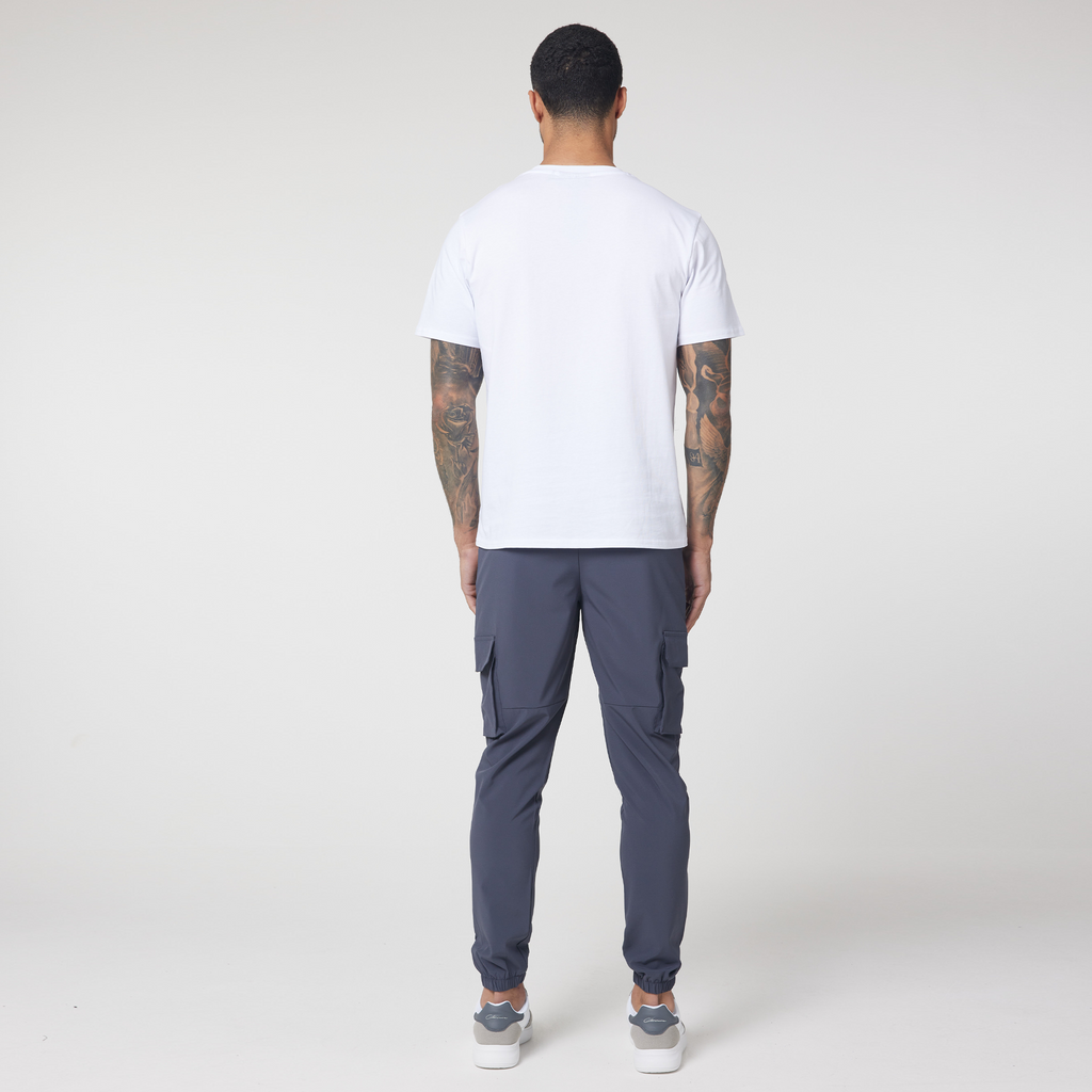 Back view of charcoal cargo pants and plain white short sleeved t-shirt