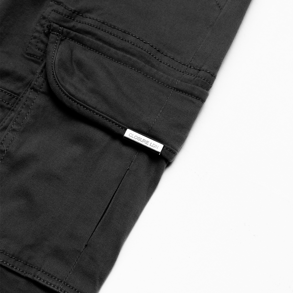 detailed picture showing the cargo pants pocket and "CLOSURE LDN" tag