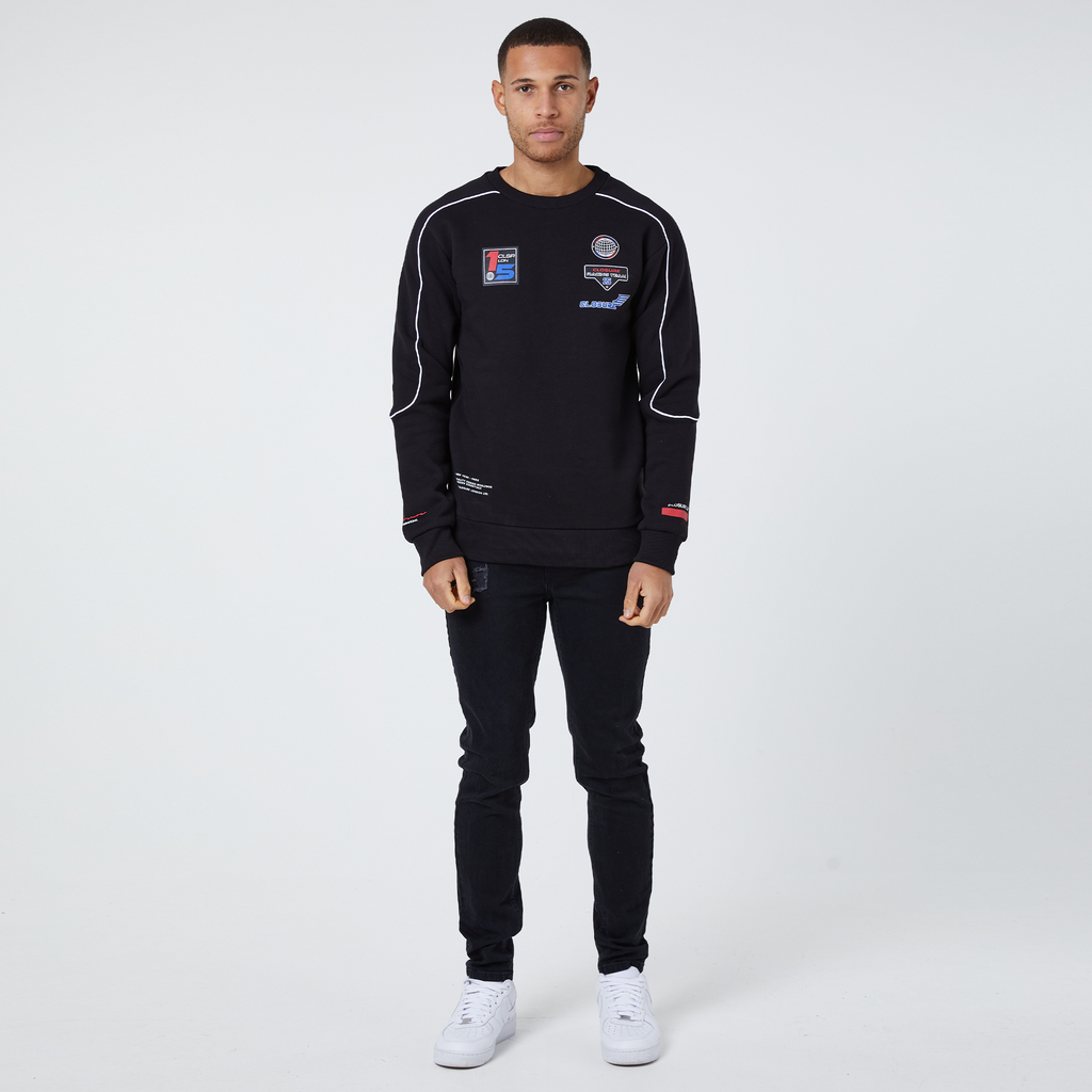 Black crewneck with racing badges and joggers