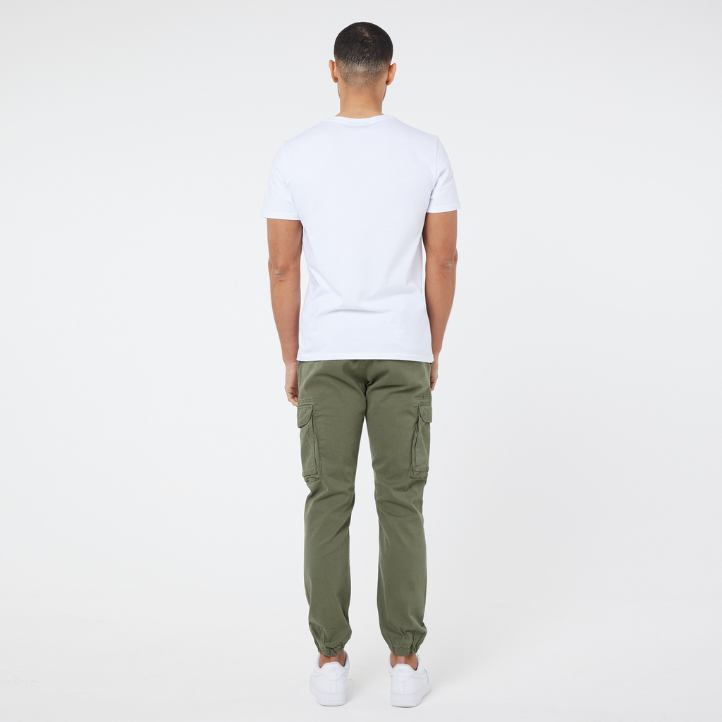 Back profile view of khaki green men's cargo pants and plain white men's top